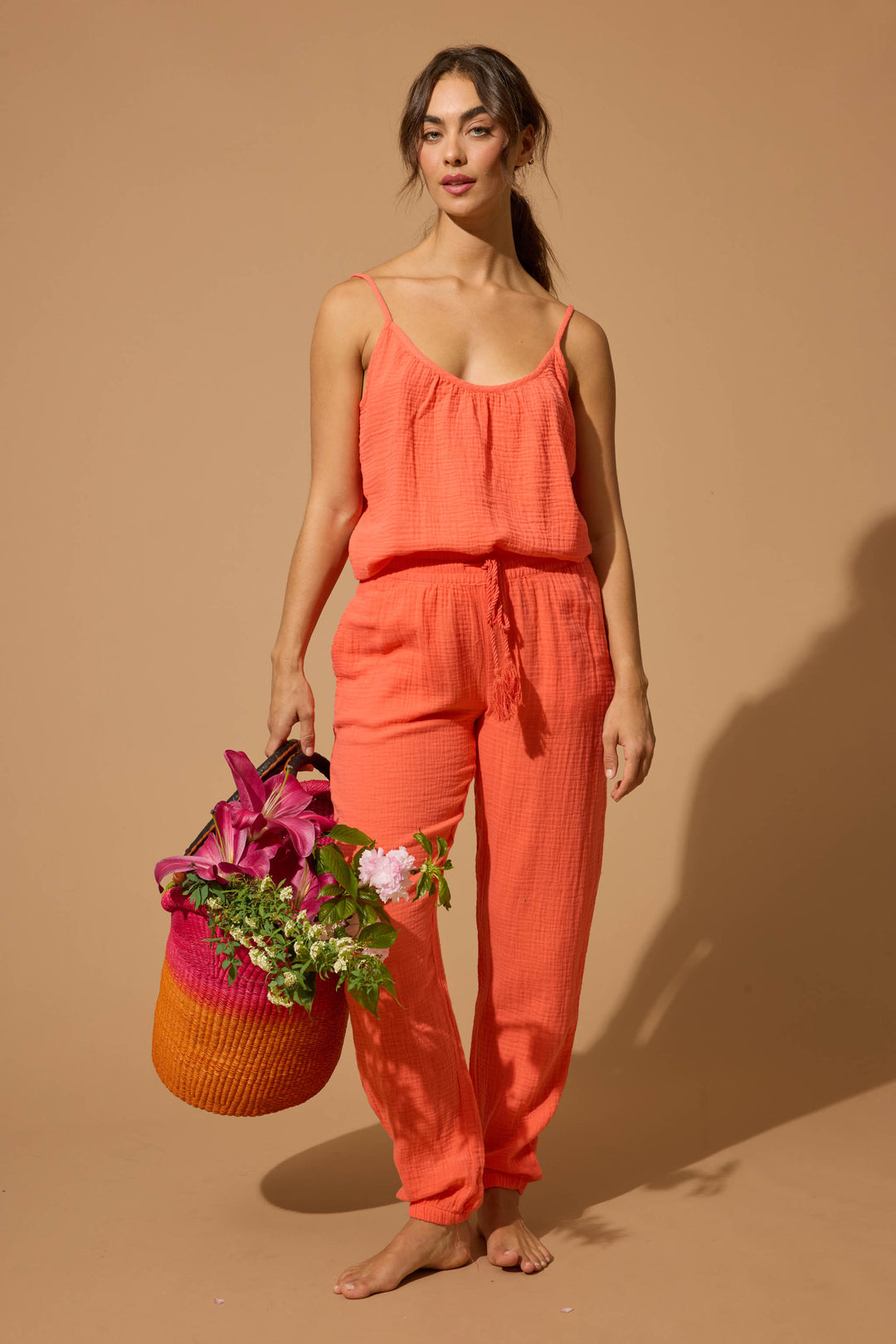 Women's red-orange lounge set top & pant in cotton woven gauze. Strappy camisole top & banded jogger styles.