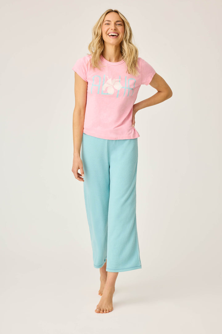 Women's lounge set of green crop lounge pant with pink Aloha print short sleeve t-shirt.
