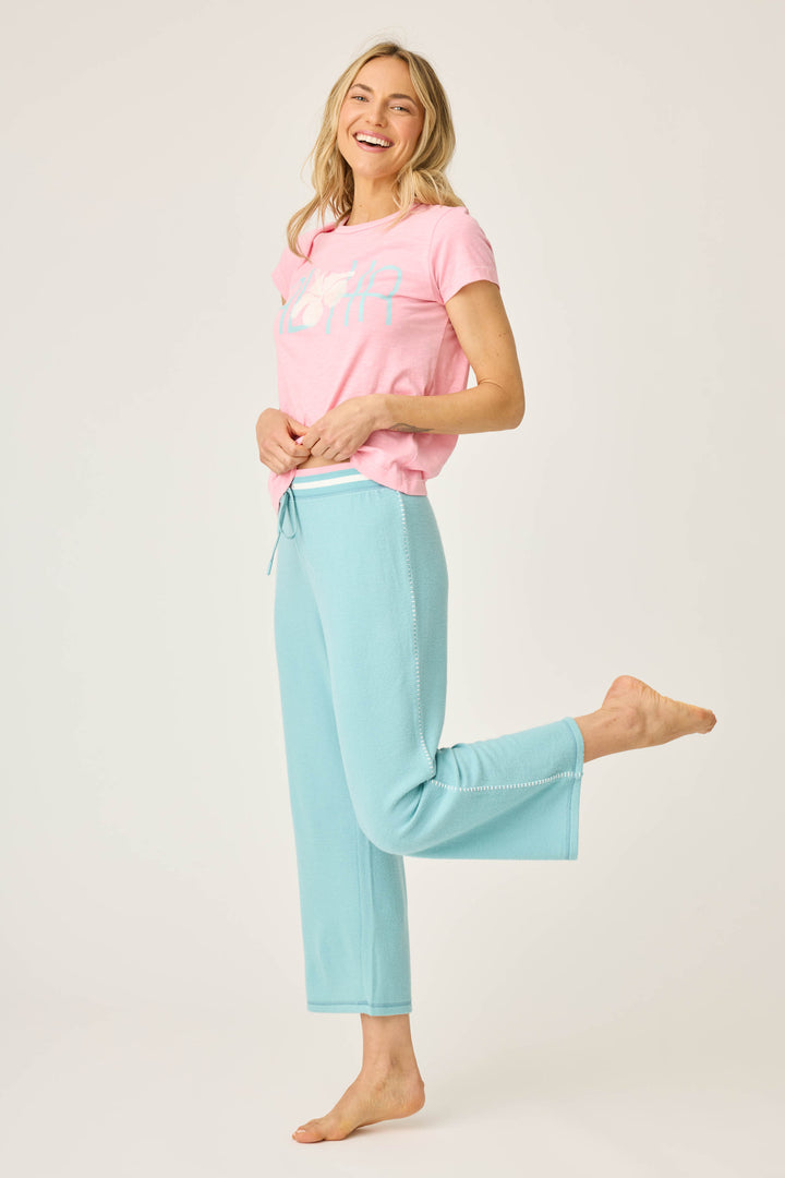 Women's lounge set of green crop lounge pant with pink Aloha print short sleeve t-shirt.