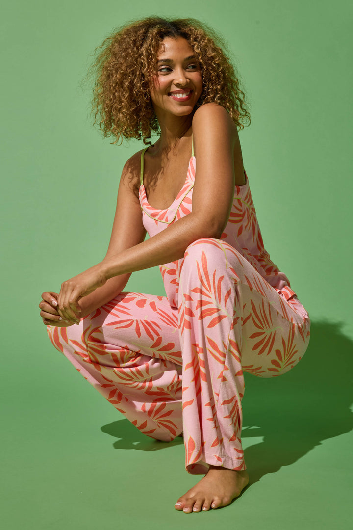 Women's pink & orange tropical print lounge set. Camisole top with adjustable straps. Open leg pant with tie waist.