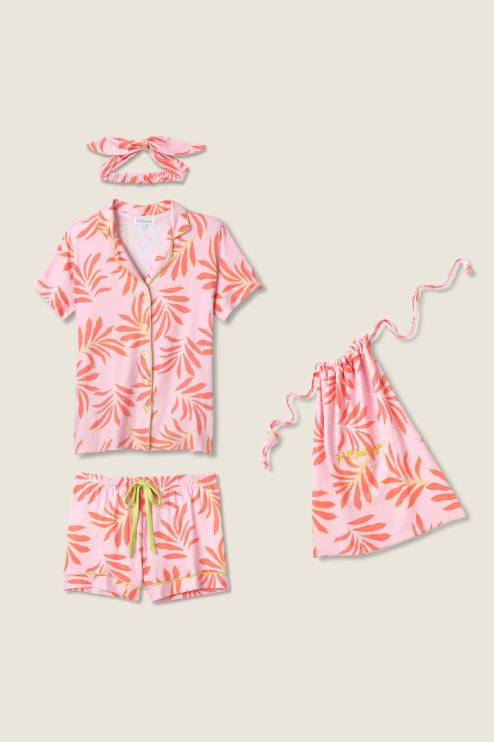 Women's pink & orange tropical print pajama short set. Short sleeve button-front top with neon green piping. Short with tie waist.