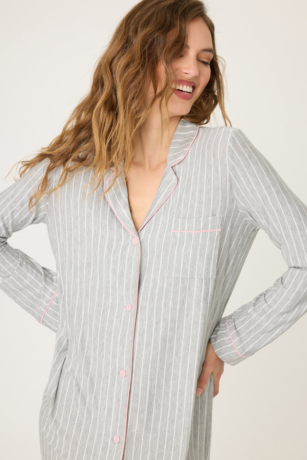 Grey-ivory pinstripe modal women's night sleep shirt with button front & pink piping contrast. Chest pocket and rounded hem.