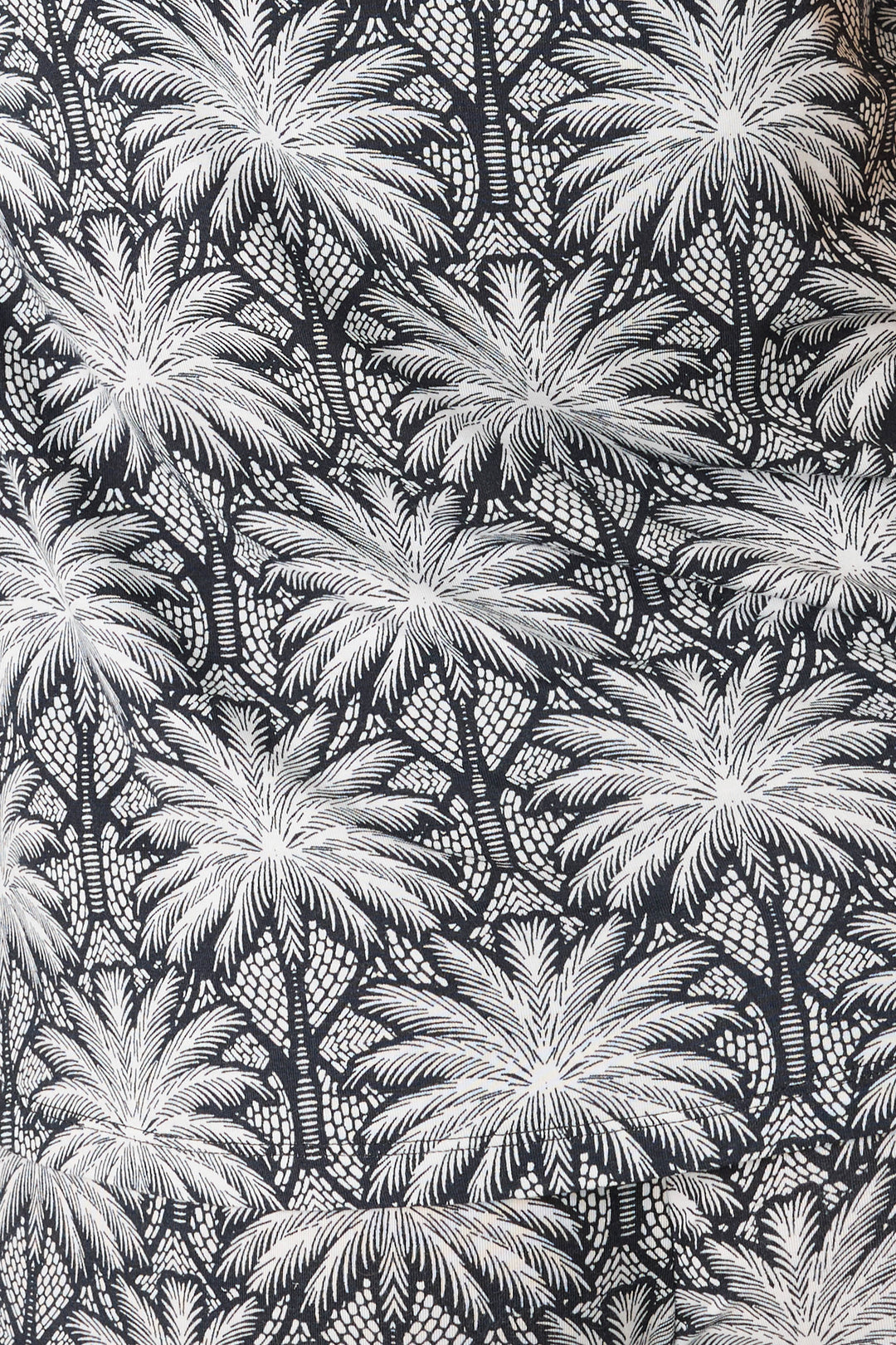 Women's black & ivory palm print pajama pant in modal. Contrast printed hem & waist ties.