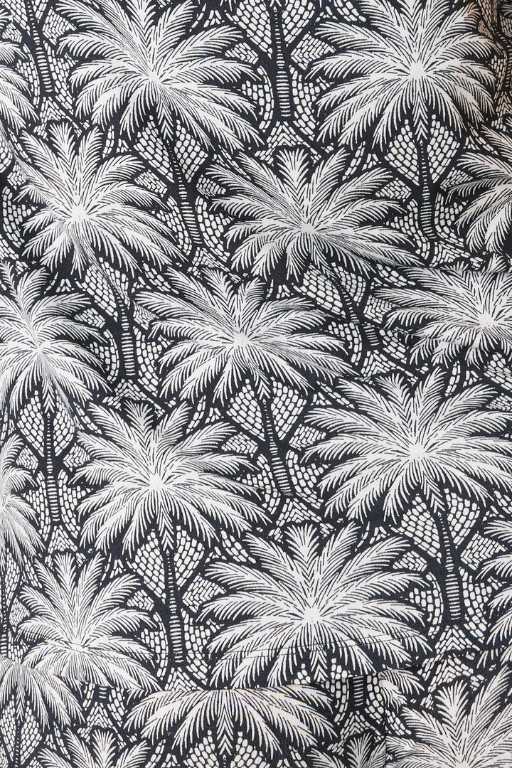 Women's black & ivory palm print pajama pant in modal. Contrast printed hem & waist ties.