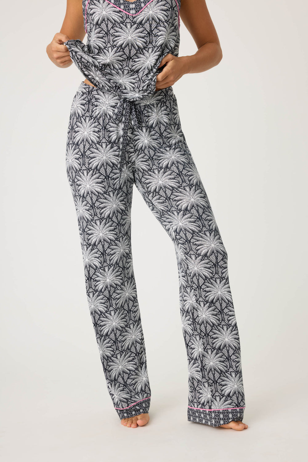 Women's black & ivory palm print pajama pant in modal. Contrast printed hem & waist ties.
