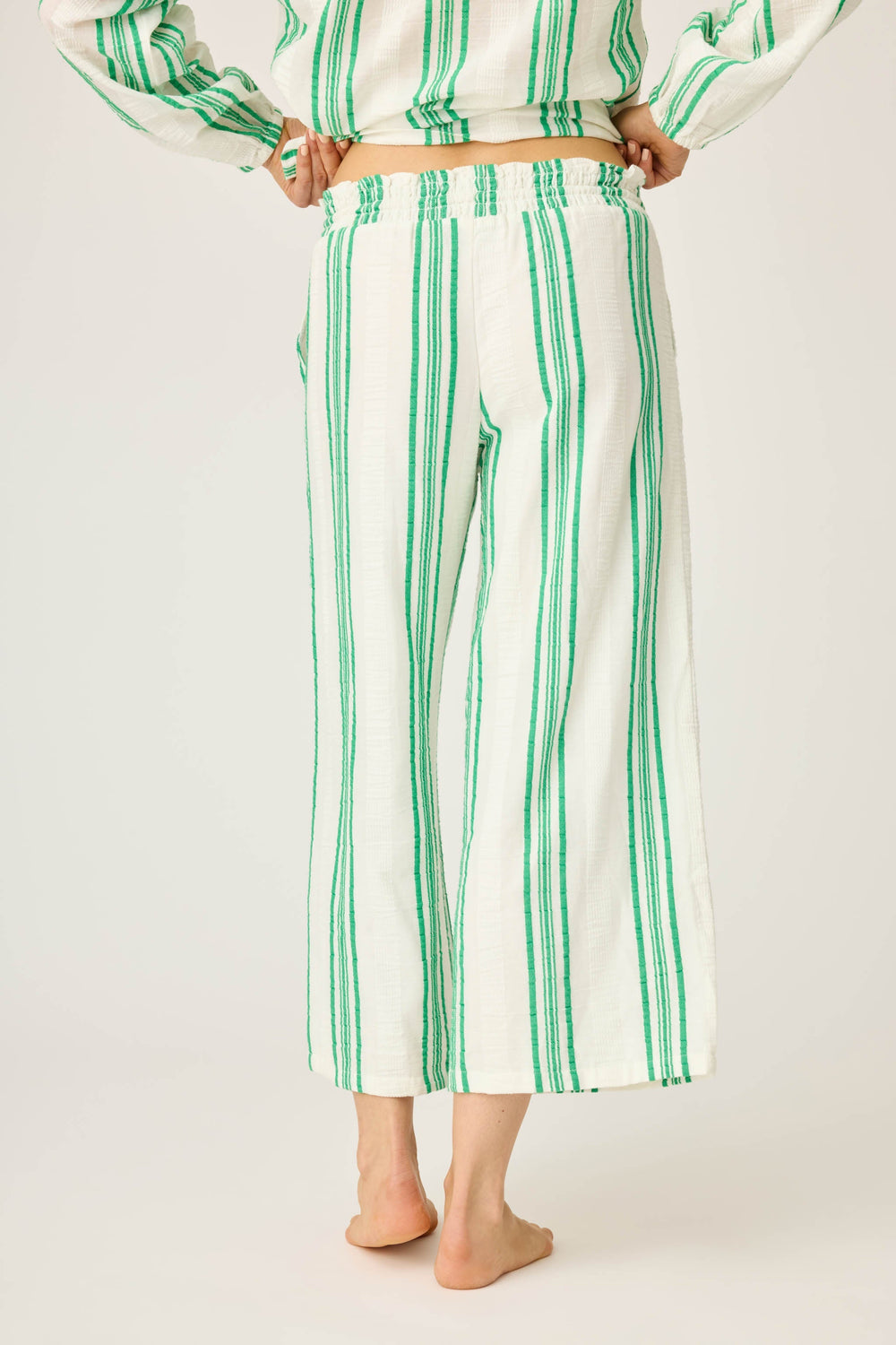 Women's green & white striped crop pant in cotton woven gauze. With pockets & tassle drawcord.