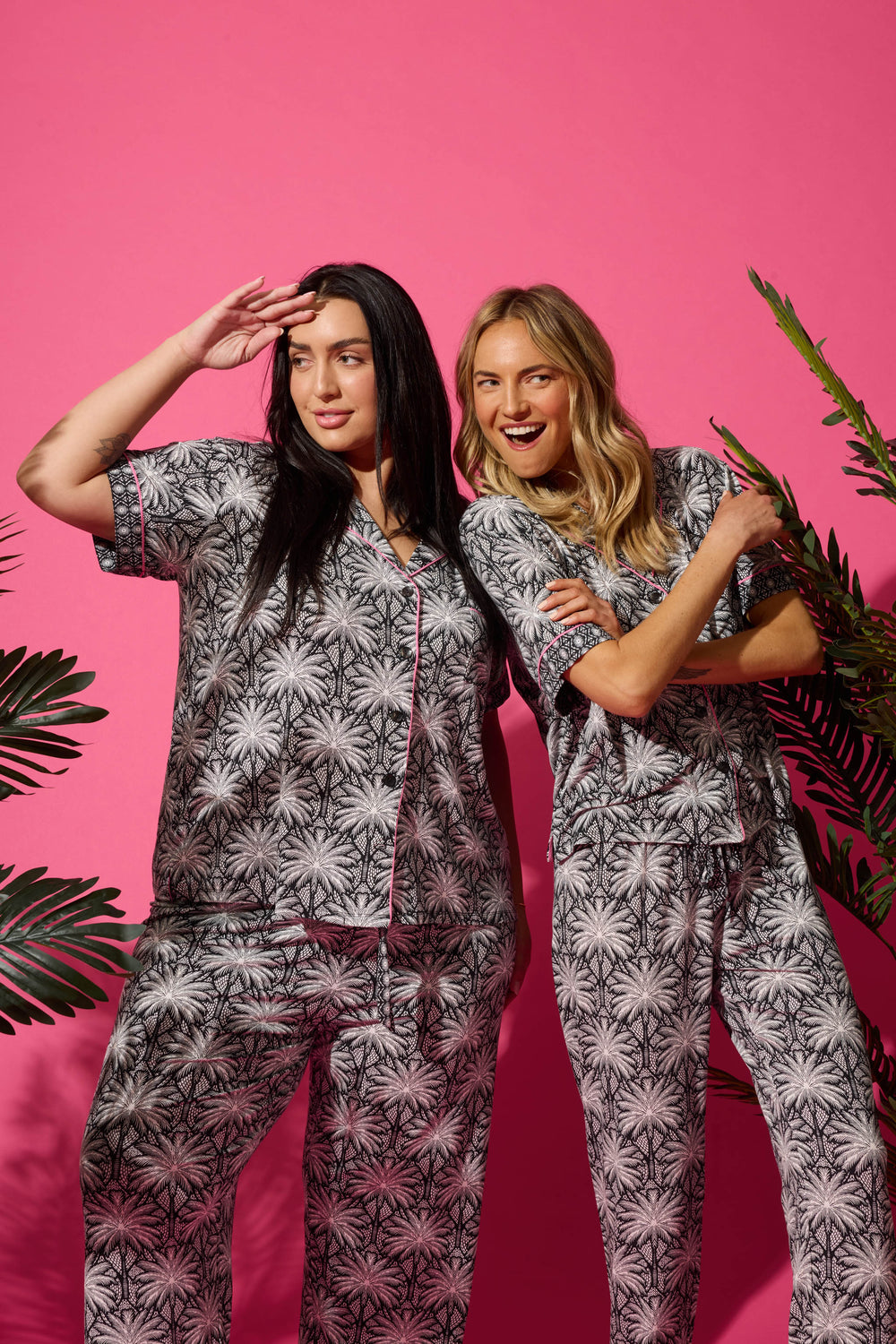Women's black & ivory palm printed pajama set in modal. Short sleeve button-front top & pajama pant with contrast pink piping.