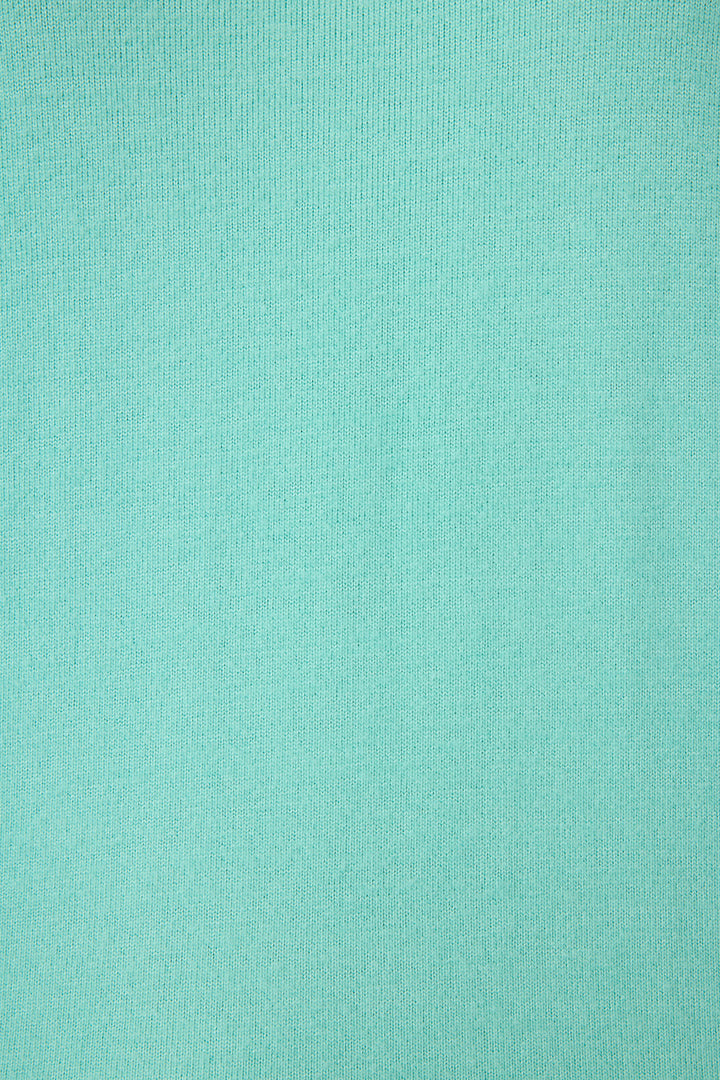 Teal green lounge set for women. Top has pink star print on elbows, pant has pockets with scallop-edging detail. Striped banded cuffs on top & pant.