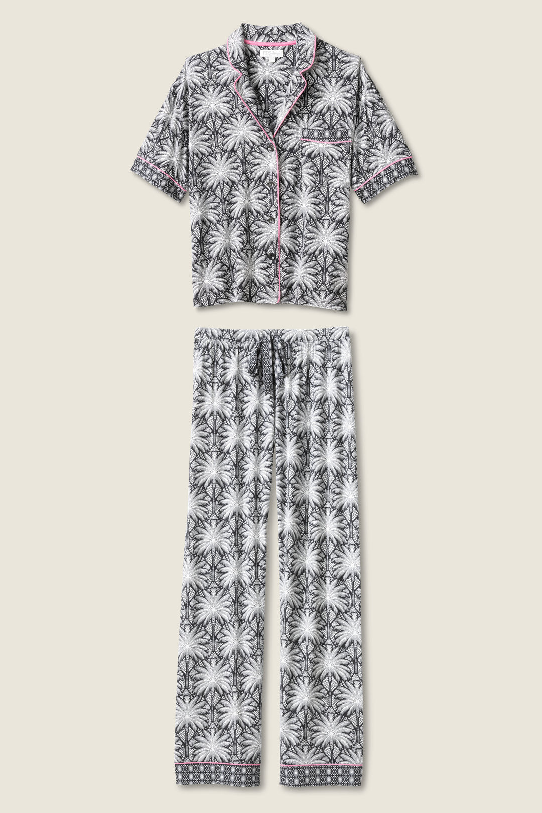 Women's black & ivory palm printed pajama set in modal. Short sleeve button-front top & pajama pant with contrast pink piping.