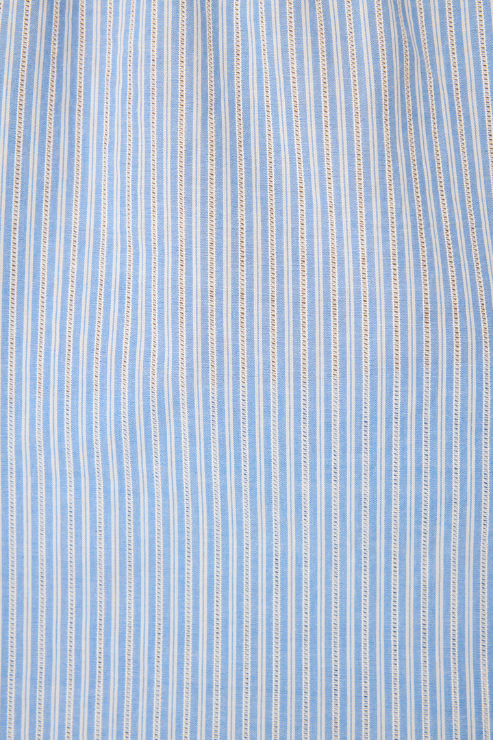Women's blue & white striped cotton lounge set. Camisole top with ladder stitching at neckline, crop pant with pockets & tassel tie waist.