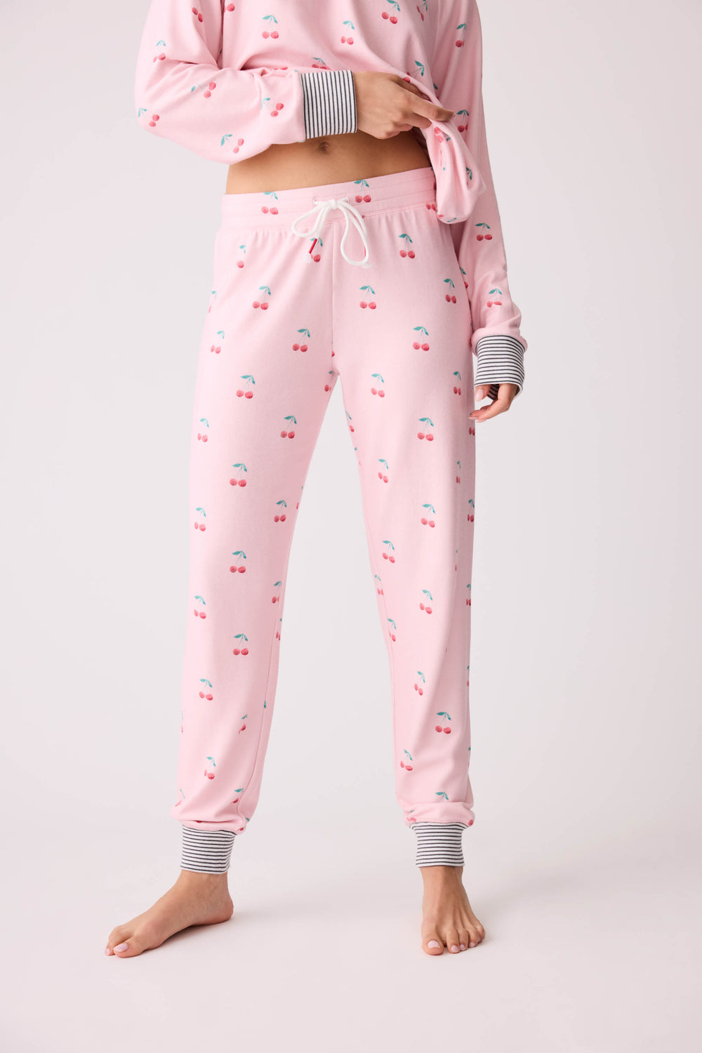 Women's pink banded pj pant with cherry pattern.