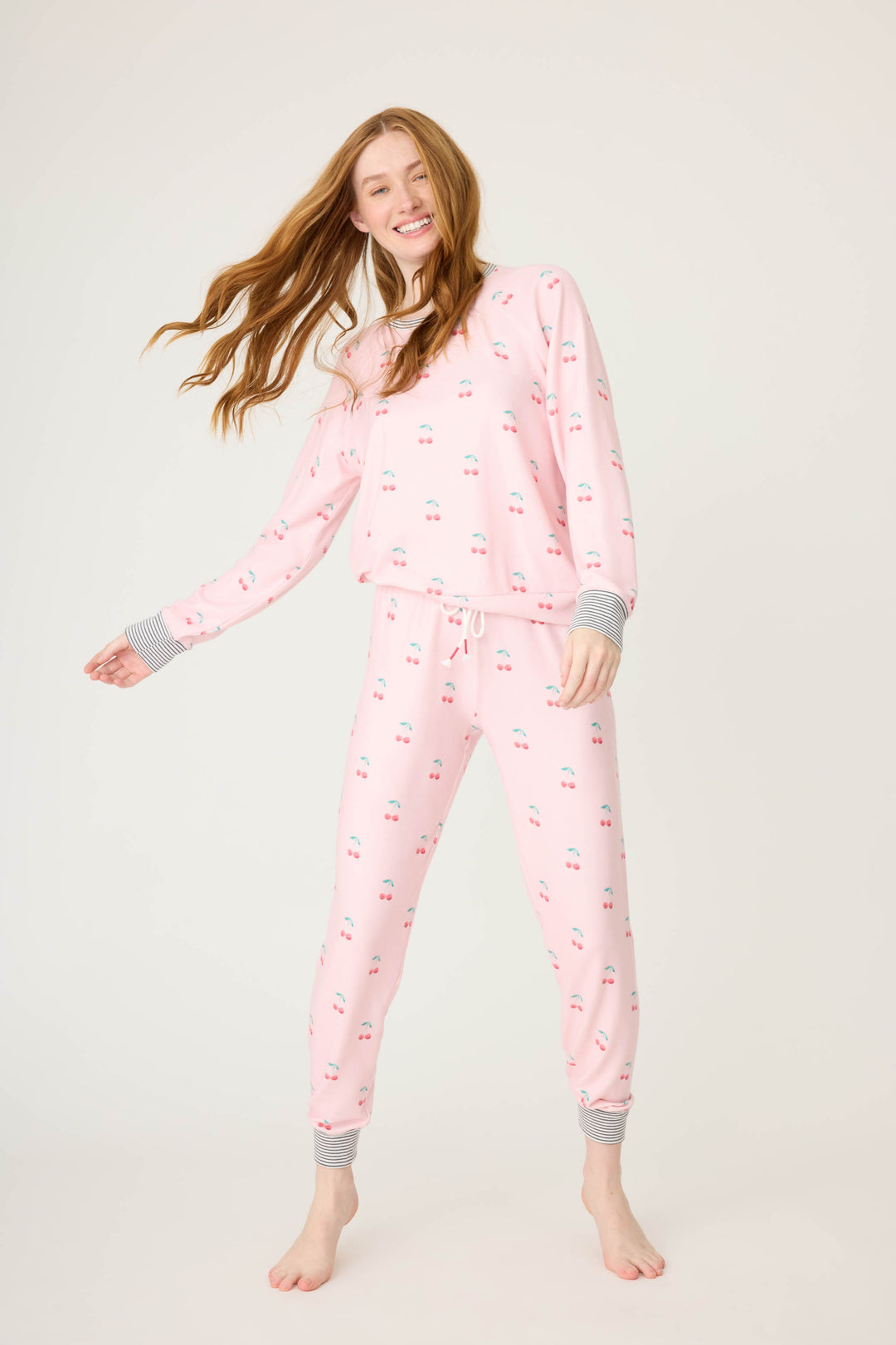 Women's pink banded pj pant with cherry pattern.