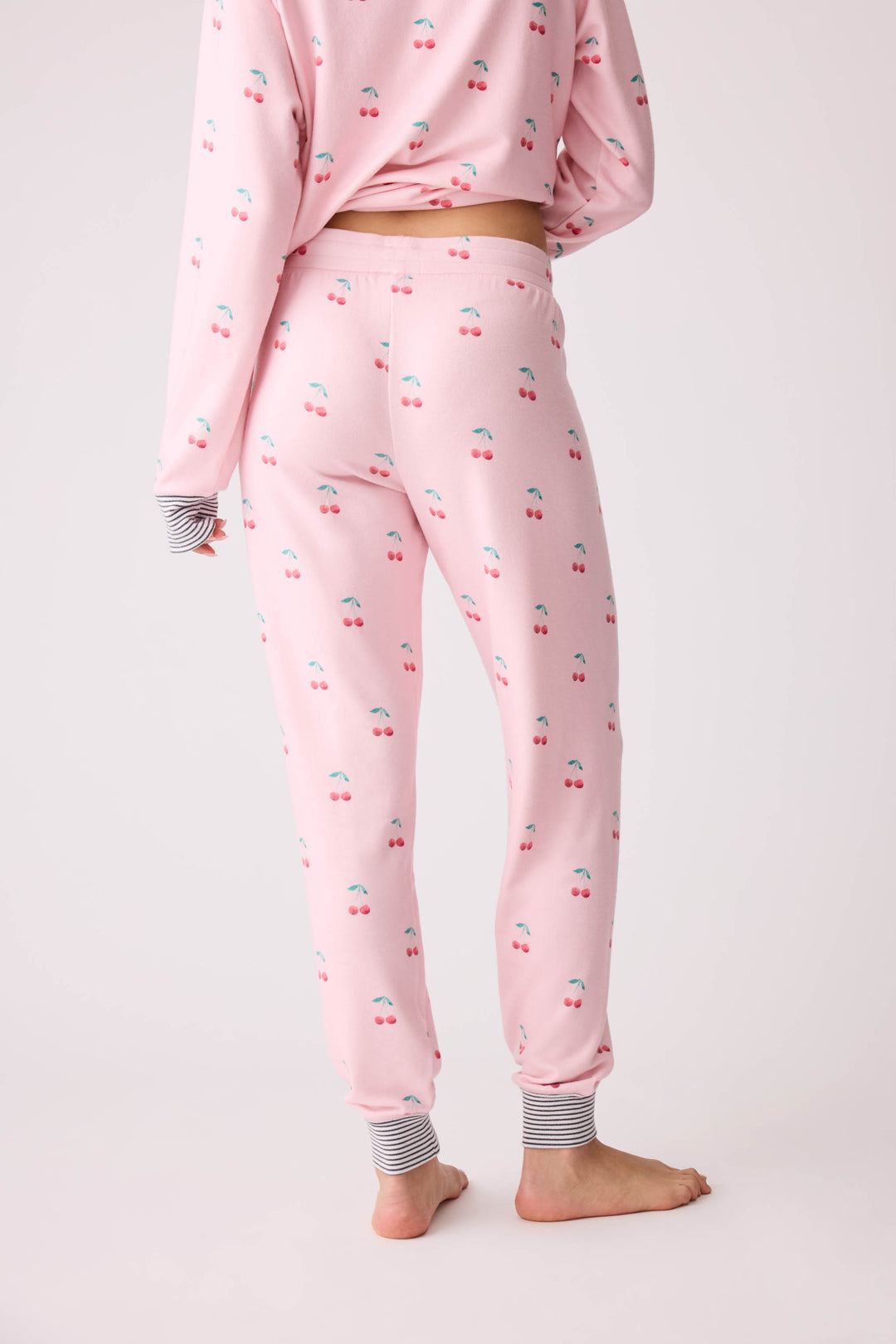 Women's pink banded pj pant with cherry pattern.