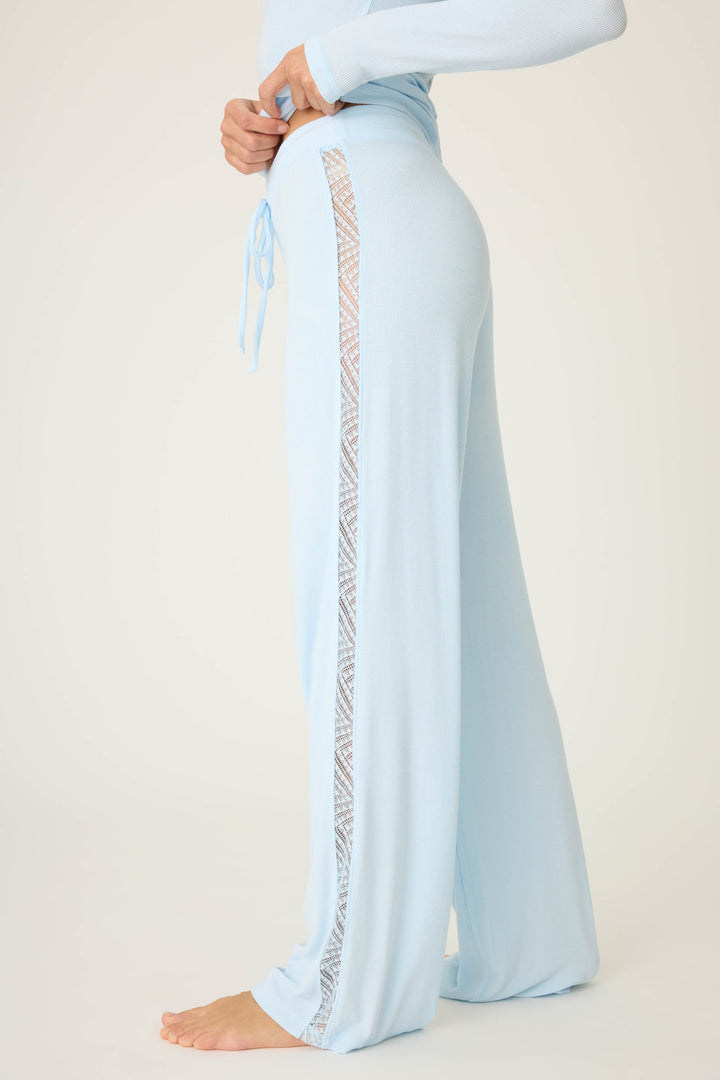 Women's semi-fitted blue lounge pant in micro-rib knit. With lace inset at side seams. Straight leg & tie-waist.