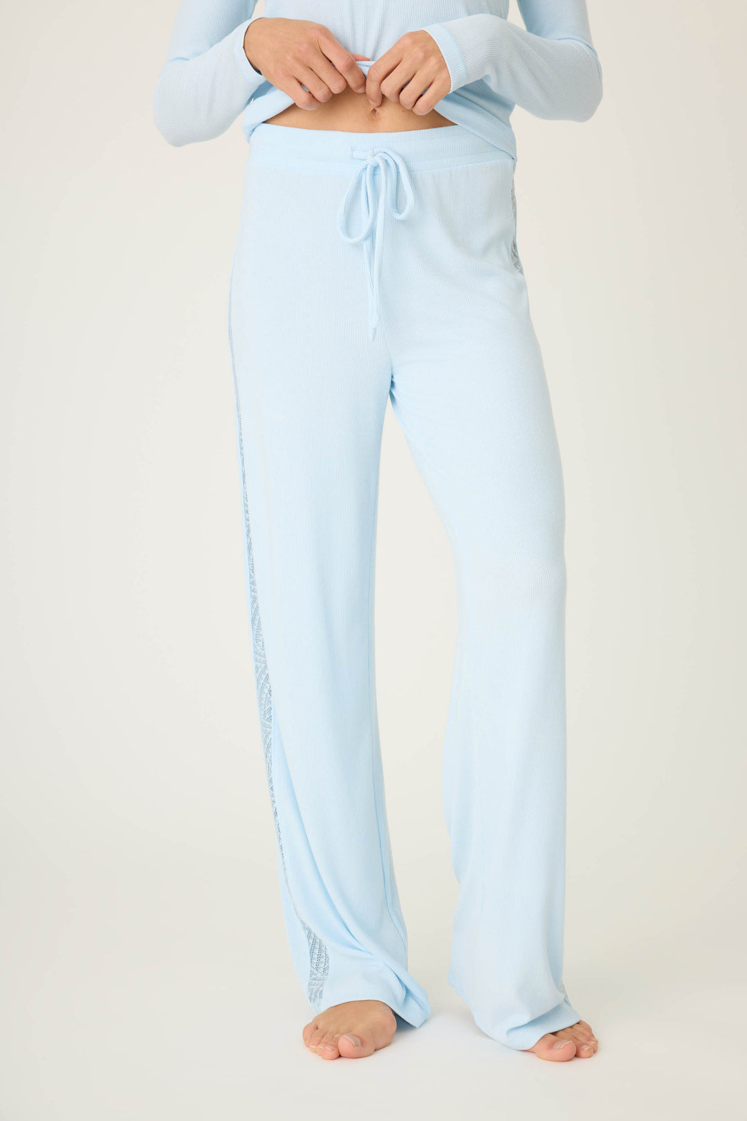 Women's semi-fitted blue lounge pant in micro-rib knit. With lace inset at side seams. Straight leg & tie-waist.