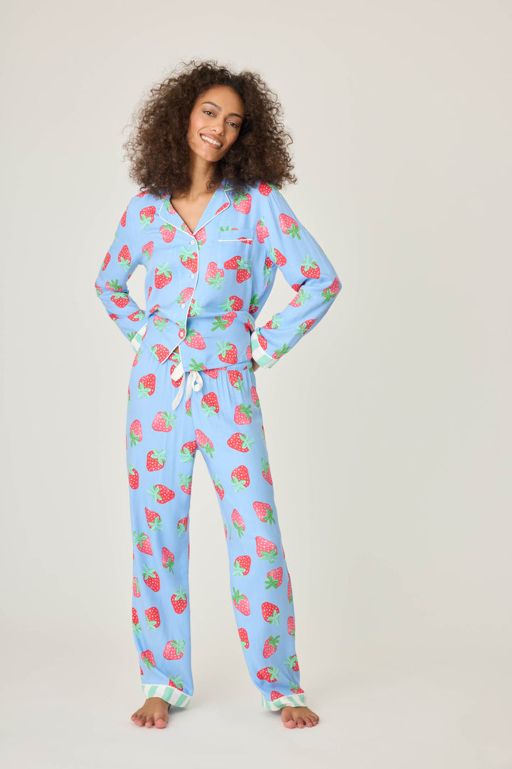 Women's pajama pant in blue with strawberry print in woven rayon sateen. Tie-waist in contrast stripe & striped cuffs.