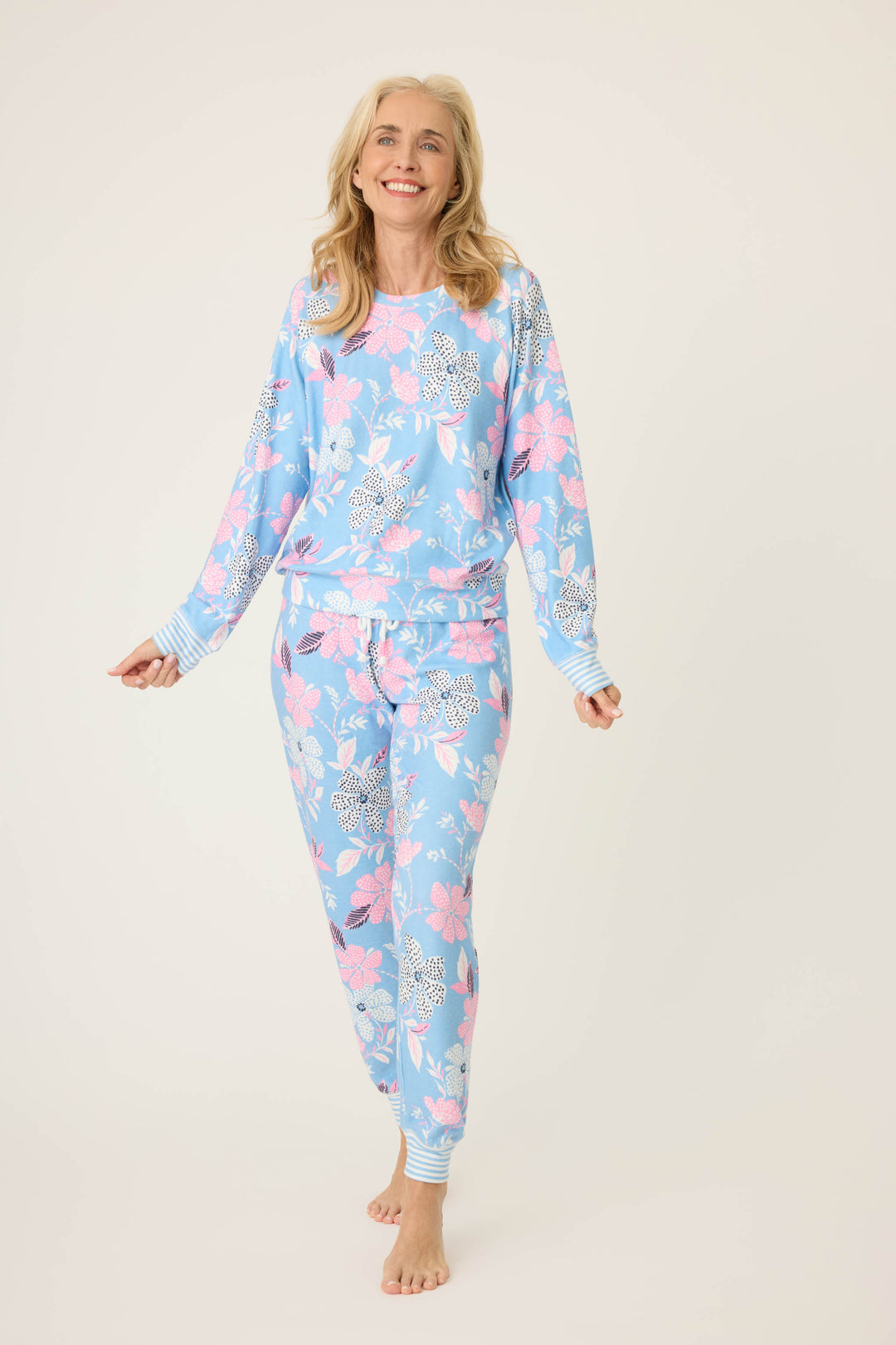 Women's ivory-blue-pink winter floral pj jogger with striped cuffs. Tie waist with faux 3-button fly.
