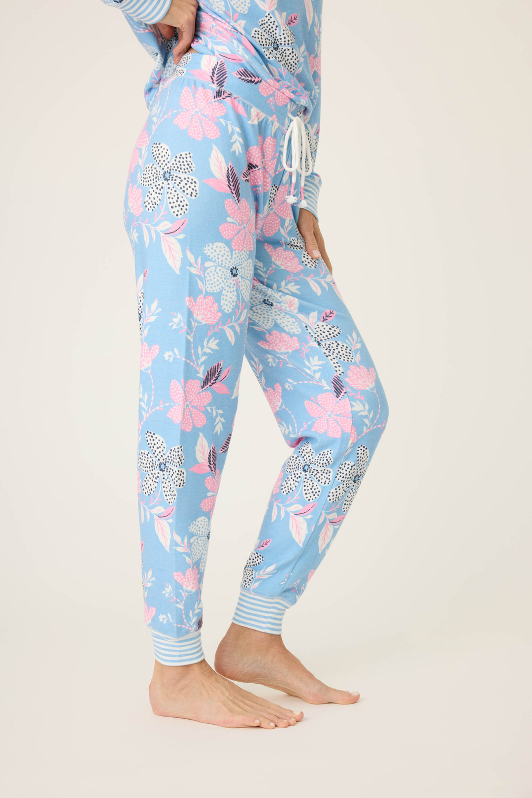 Women's ivory-blue-pink winter floral pj jogger with striped cuffs. Tie waist with faux 3-button fly.