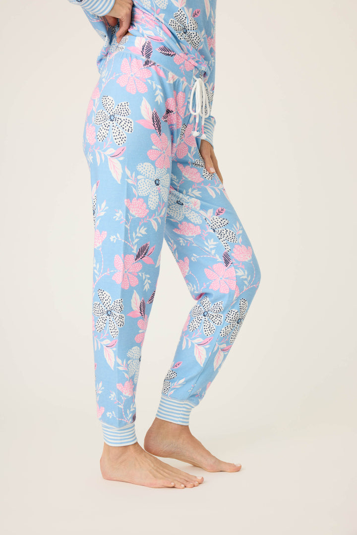 Women's ivory-blue-pink winter floral pj jogger with striped cuffs. Tie waist with faux 3-button fly.