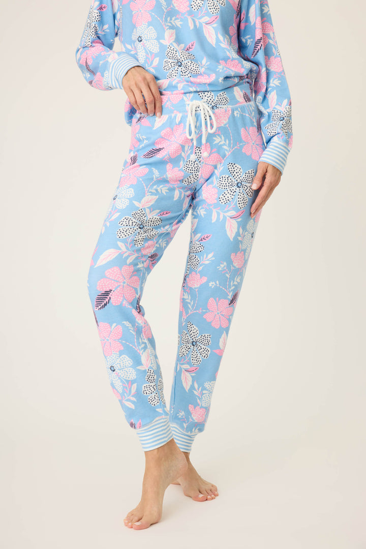 Women's ivory-blue-pink winter floral pj jogger with striped cuffs. Tie waist with faux 3-button fly.