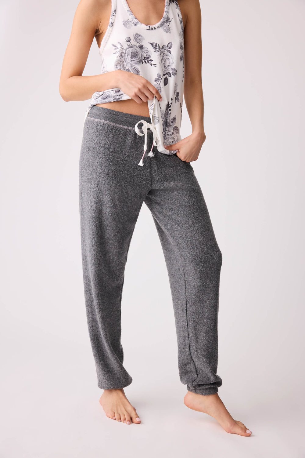 Women's dark banded pj pant with rose embroidery on hip.