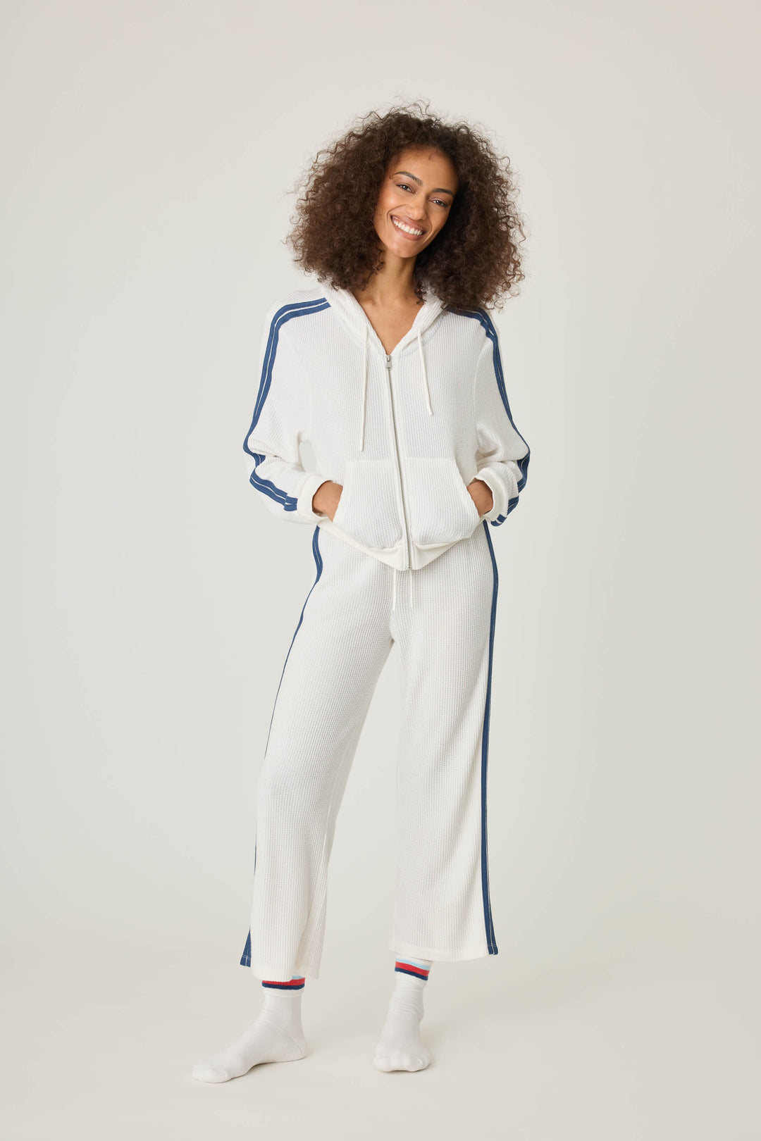 Women's ivory cropped lounge pant with navy athletic stripes on side. Tie waist.