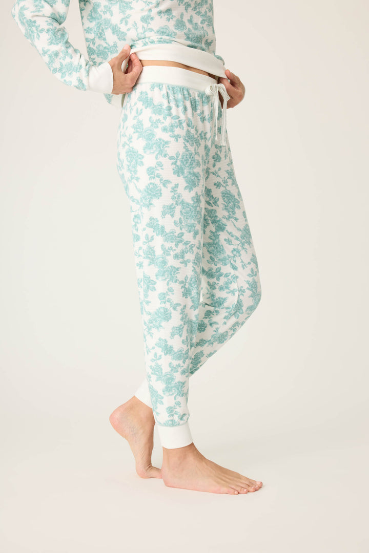 Women's white banded pj pant with jade floral pattern.