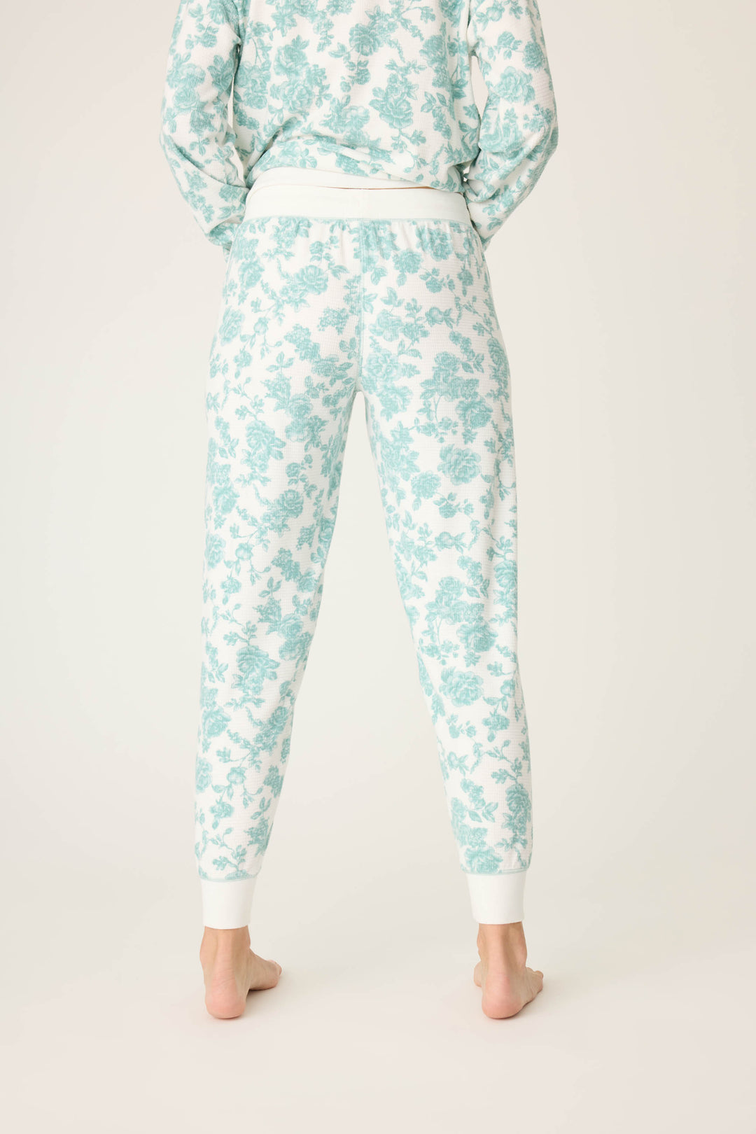 Women's white banded pj pant with jade floral pattern.