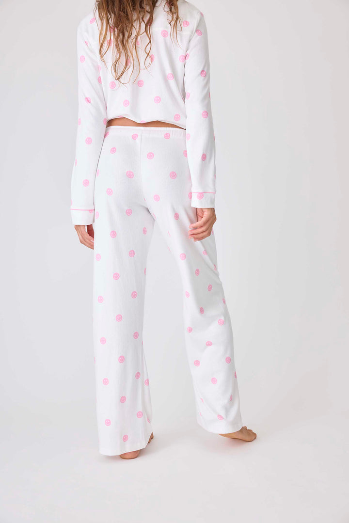 Women's ivory pajama pant with pink happy face pattern. Exclusive PJS x Susan G Komen style.