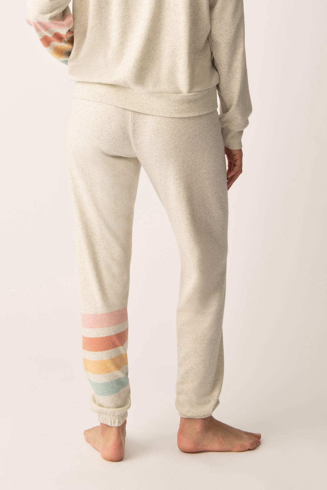 Women's jogger pant in oatmeal with graphic stripe print on leg. Tie waist.