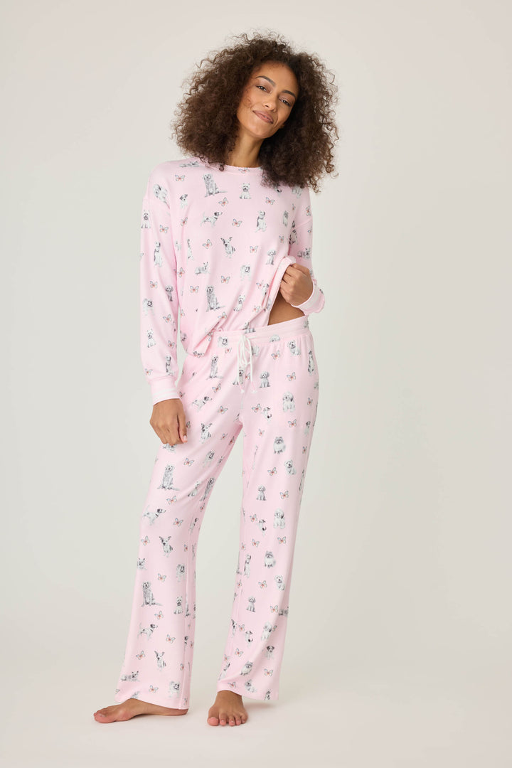 Pink dog-printed pajama pant for women with tie waist & side pockets.