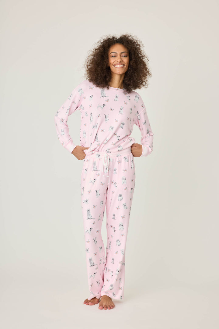 Pink dog-printed pajama pant for women with tie waist & side pockets.