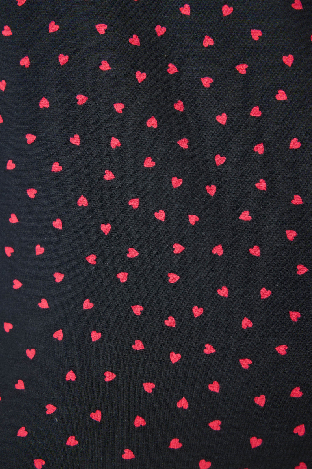 Women's black collared pj short sleeve with pj shorts with pink heart pattern.
