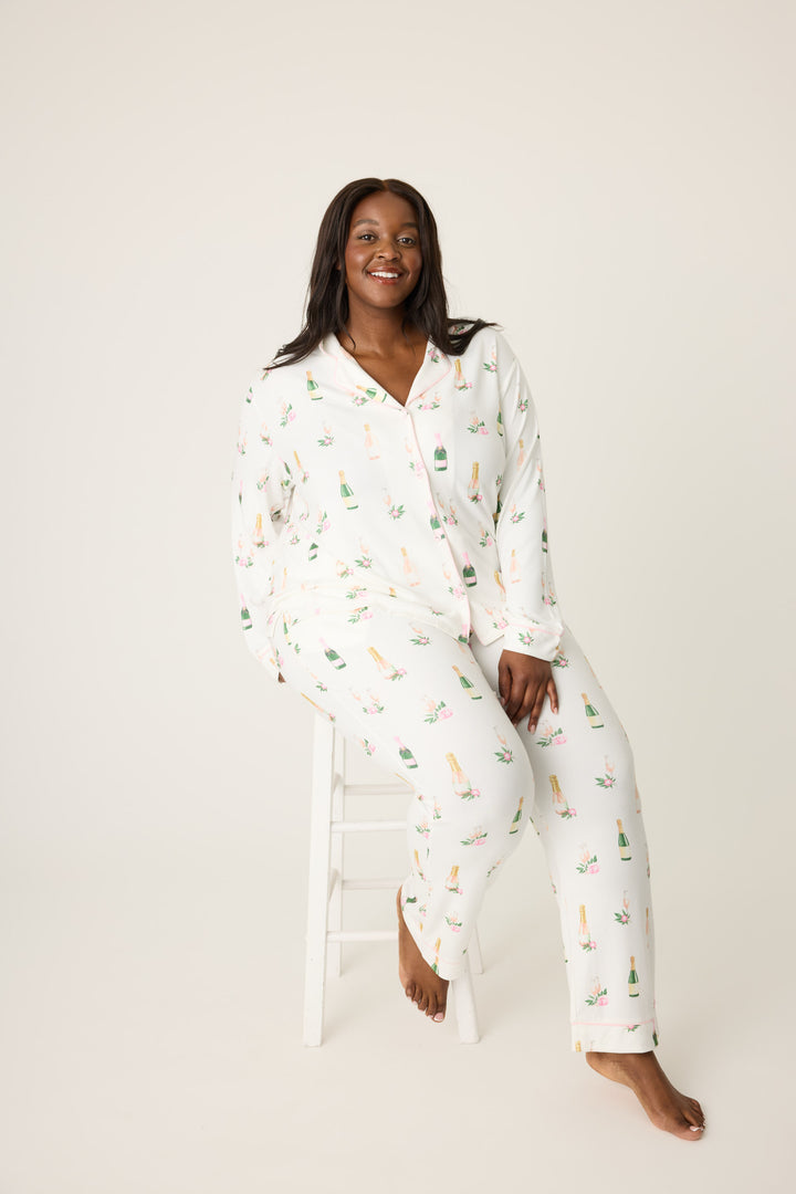 Women's white collared pj top and tie waist pant with champagne pattern.
