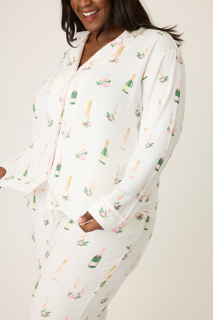 Women's white collared pj top and tie waist pant with champagne pattern.