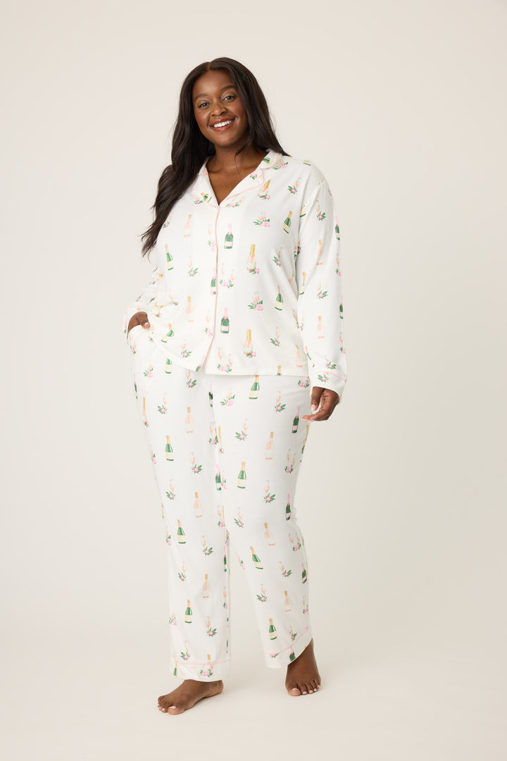 Women's white collared pj top and tie waist pant with champagne pattern.