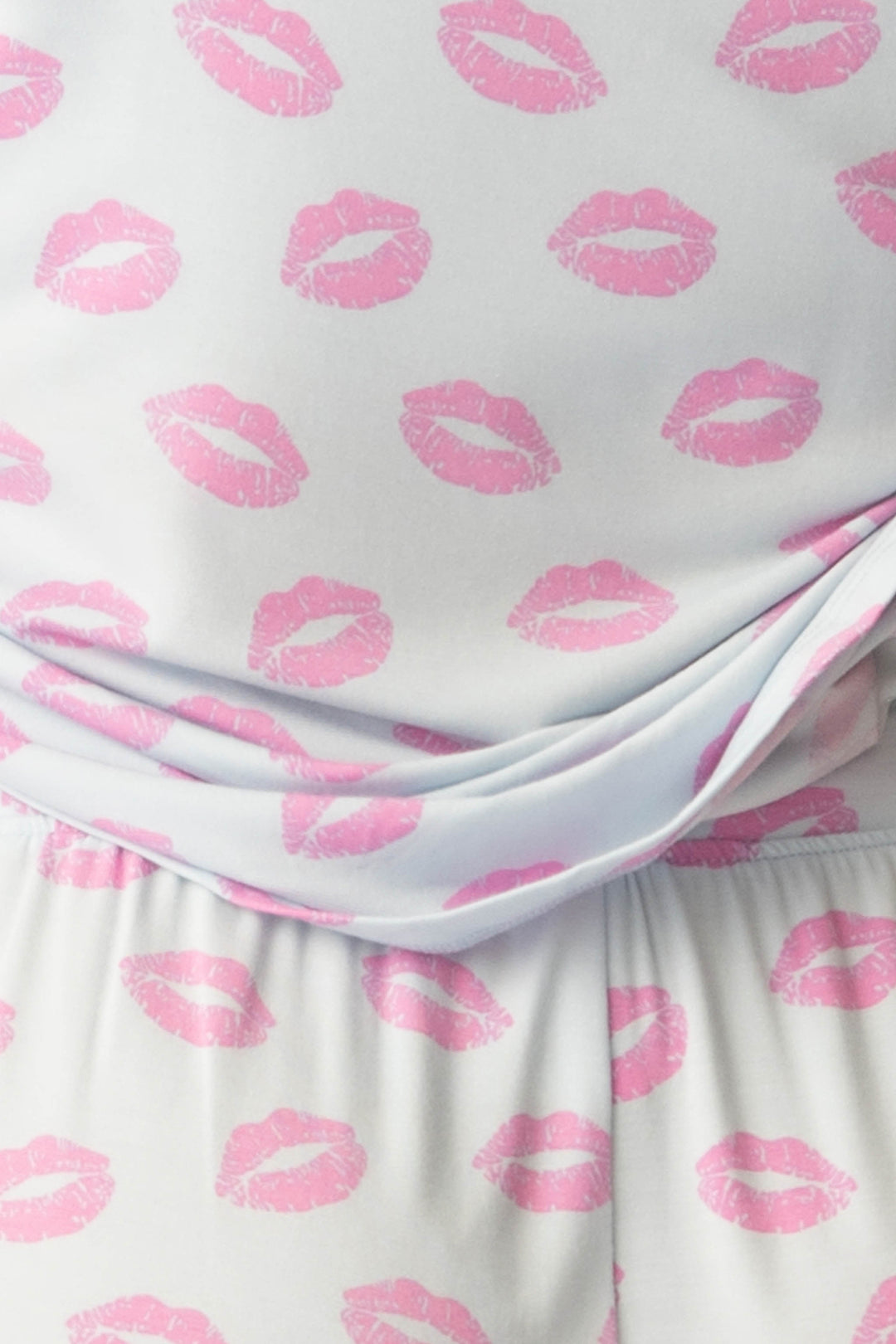 Women's blue pj tank with shelf bra and tie waist pants with pink kiss pattern.