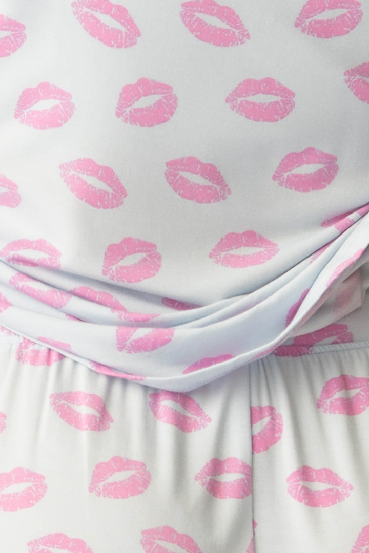 Women's blue pj tank with shelf bra and tie waist pants with pink kiss pattern.