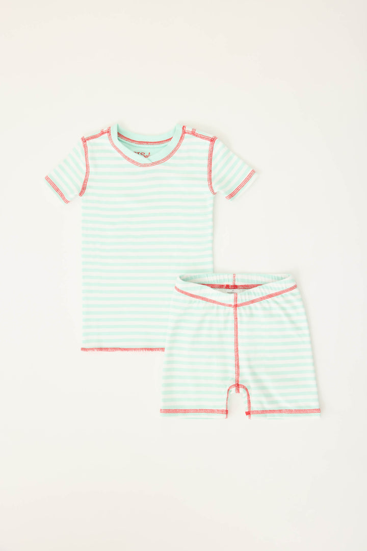 Gender-neutral kids' pajama in mint-ivory stripes with contrast red stitching.