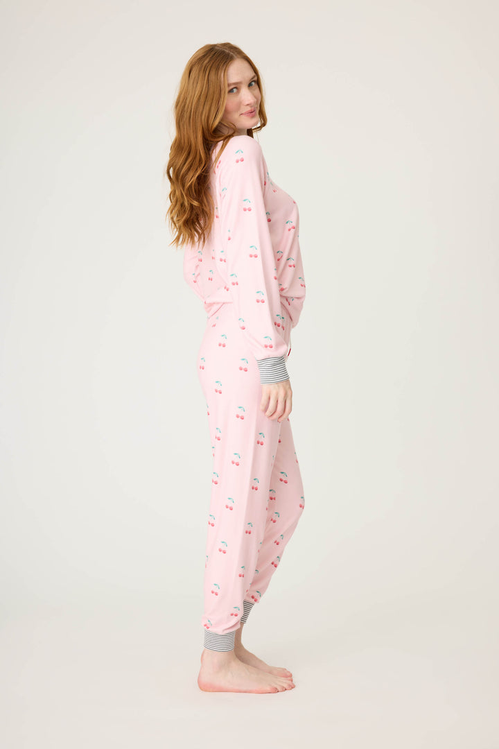 Women's pink jammie top and banded pj pant with cherry pattern.