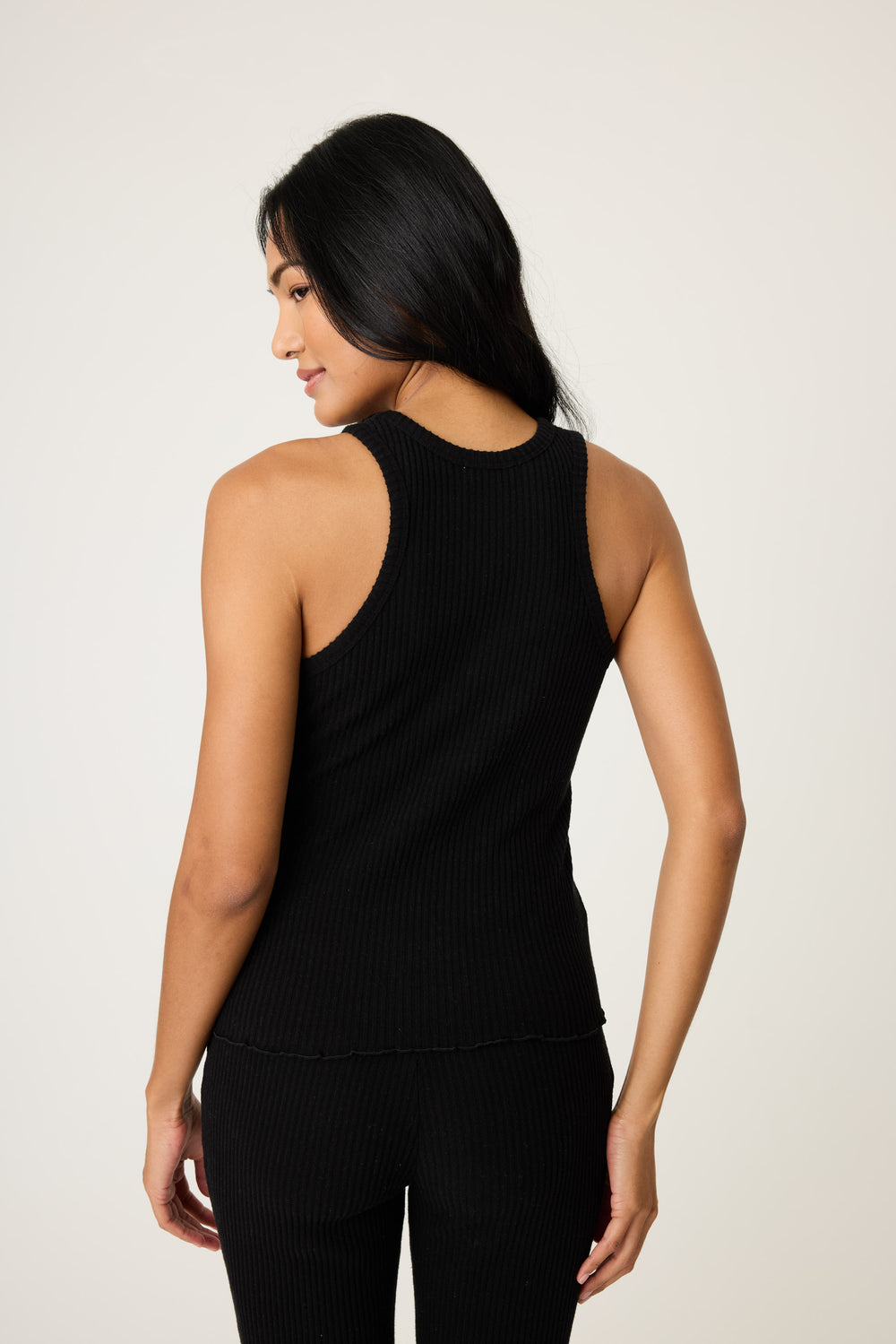 Women's black rib lounge set tank top & high-waisted pant in Repreve knit.