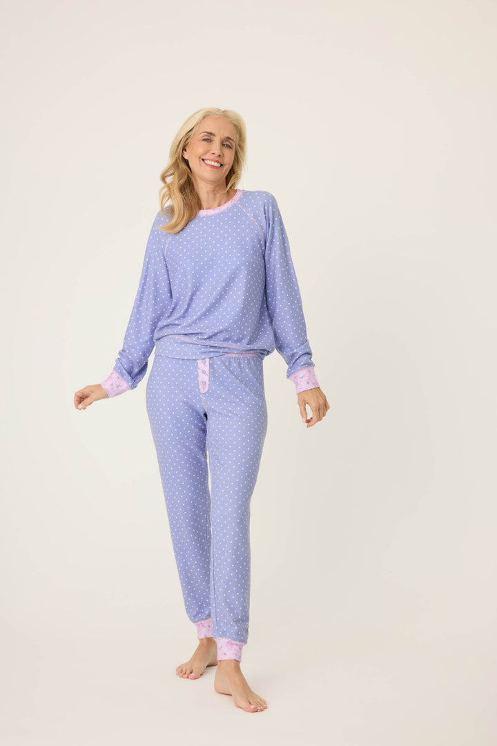 Women's jammie set with long sleeve top & banded pj pant. Peachy jersey in blue polka dot with contrast floral cuffs.