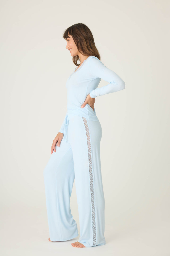 Women's blue long sleeve fitted top with lace neckline & lounge pant with lace inset sideseaoms.