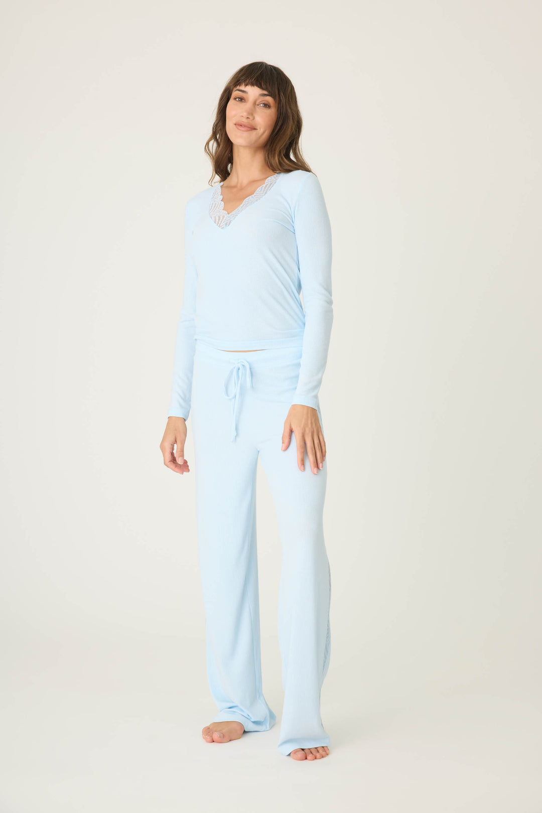 Women's blue long sleeve fitted top with lace neckline & lounge pant with lace inset sideseaoms.