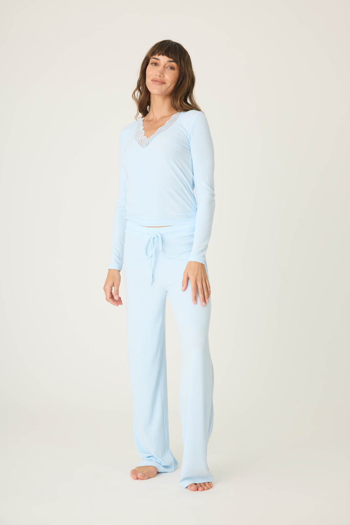 Women's blue long sleeve fitted top with lace neckline & lounge pant with lace inset sideseaoms.