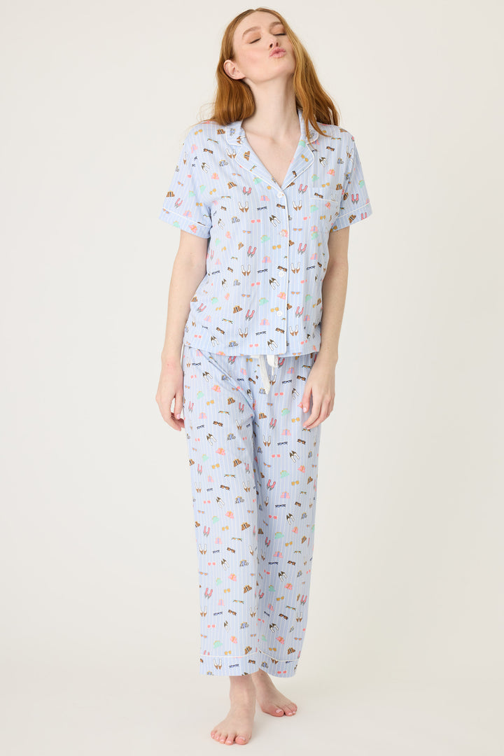 Women's breathable cotton-modal jersey short sleeve pajama set in light blue fashion shoe print. With blue contrast piping & tie. Button-front top & open leg pant.
