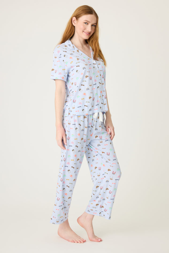 Women's breathable cotton-modal jersey short sleeve pajama set in light blue fashion shoe print. With blue contrast piping & tie. Button-front top & open leg pant.