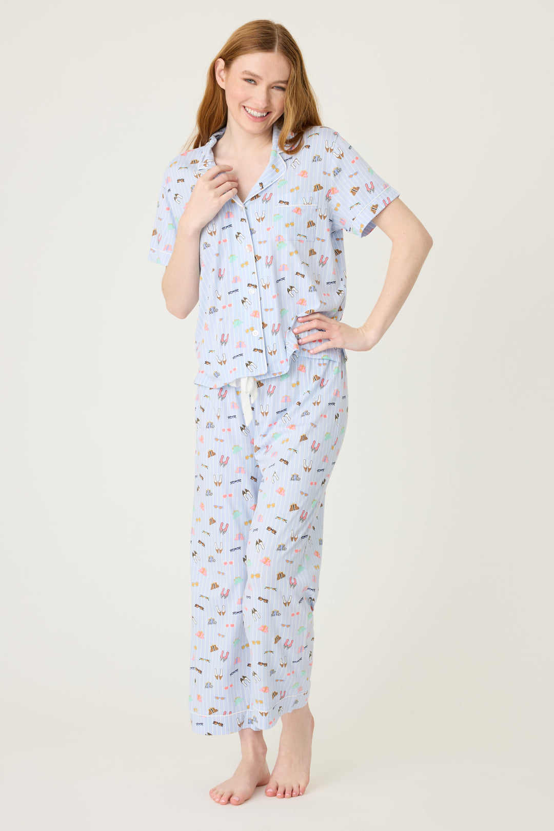 Women's breathable cotton-modal jersey short sleeve pajama set in light blue fashion shoe print. With blue contrast piping & tie. Button-front top & open leg pant.