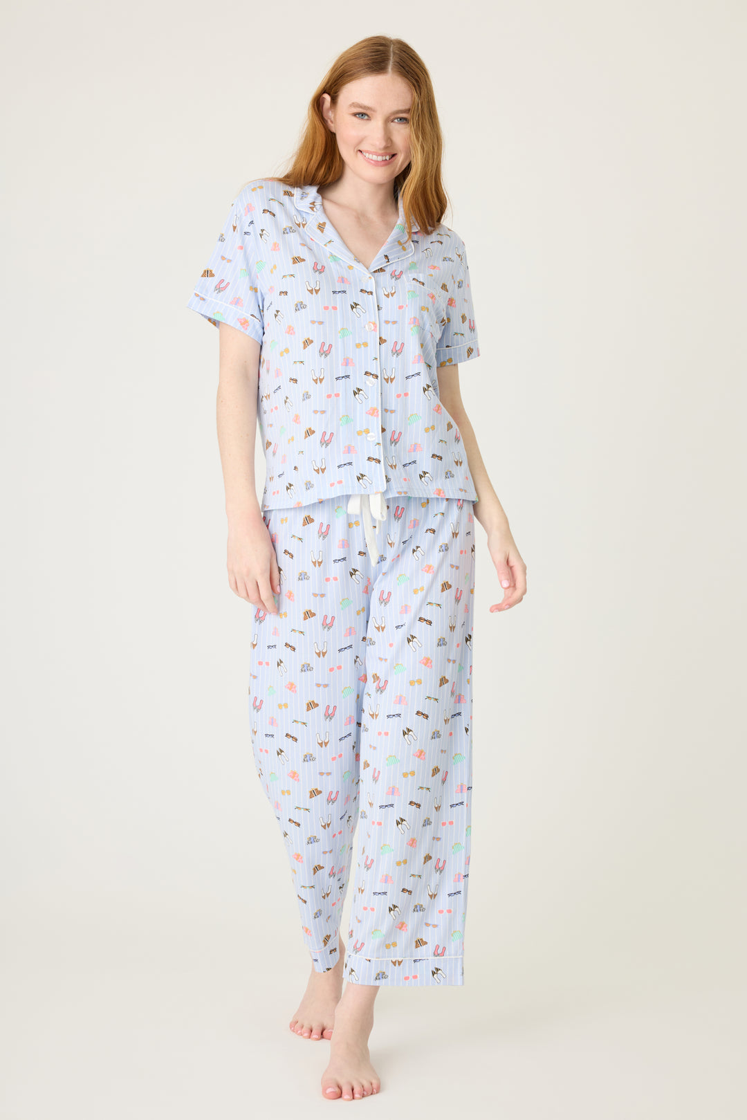 Women's breathable cotton-modal jersey short sleeve pajama set in light blue fashion shoe print. With blue contrast piping & tie. Button-front top & open leg pant.