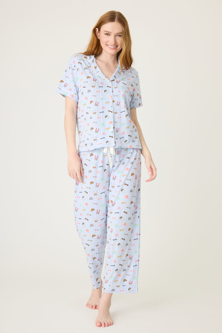 Women's breathable cotton-modal jersey short sleeve pajama set in light blue fashion shoe print. With blue contrast piping & tie. Button-front top & open leg pant.